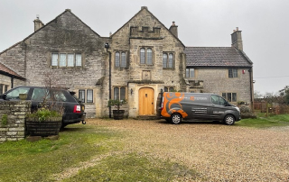 Mitchell and Dickinson vans outside a stunning period property