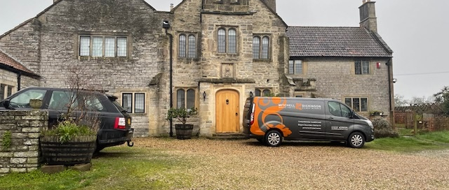 Mitchell and Dickinson vans outside a stunning period property